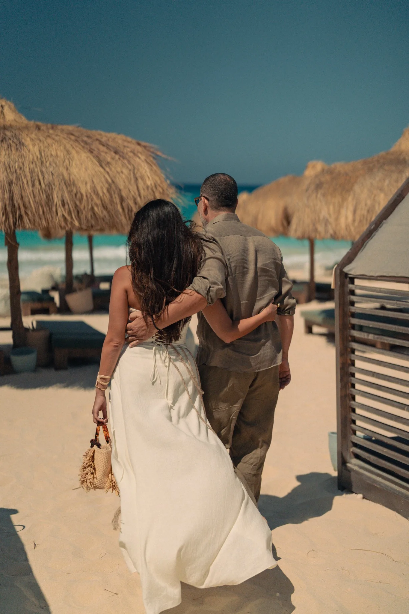 A couple walking toward the sea at Route 5