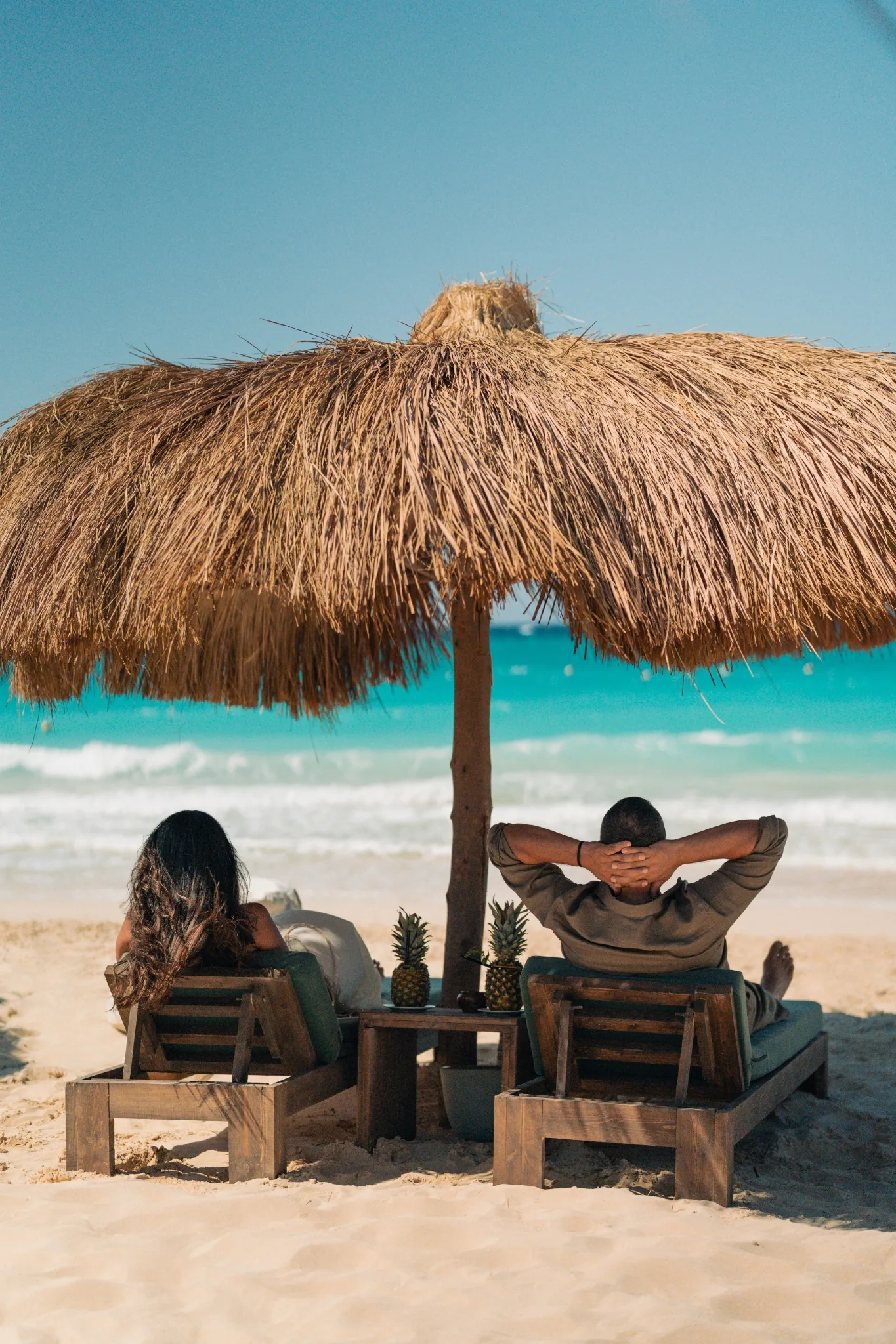 Premium umbrella seating facing the Mediterranean Sea