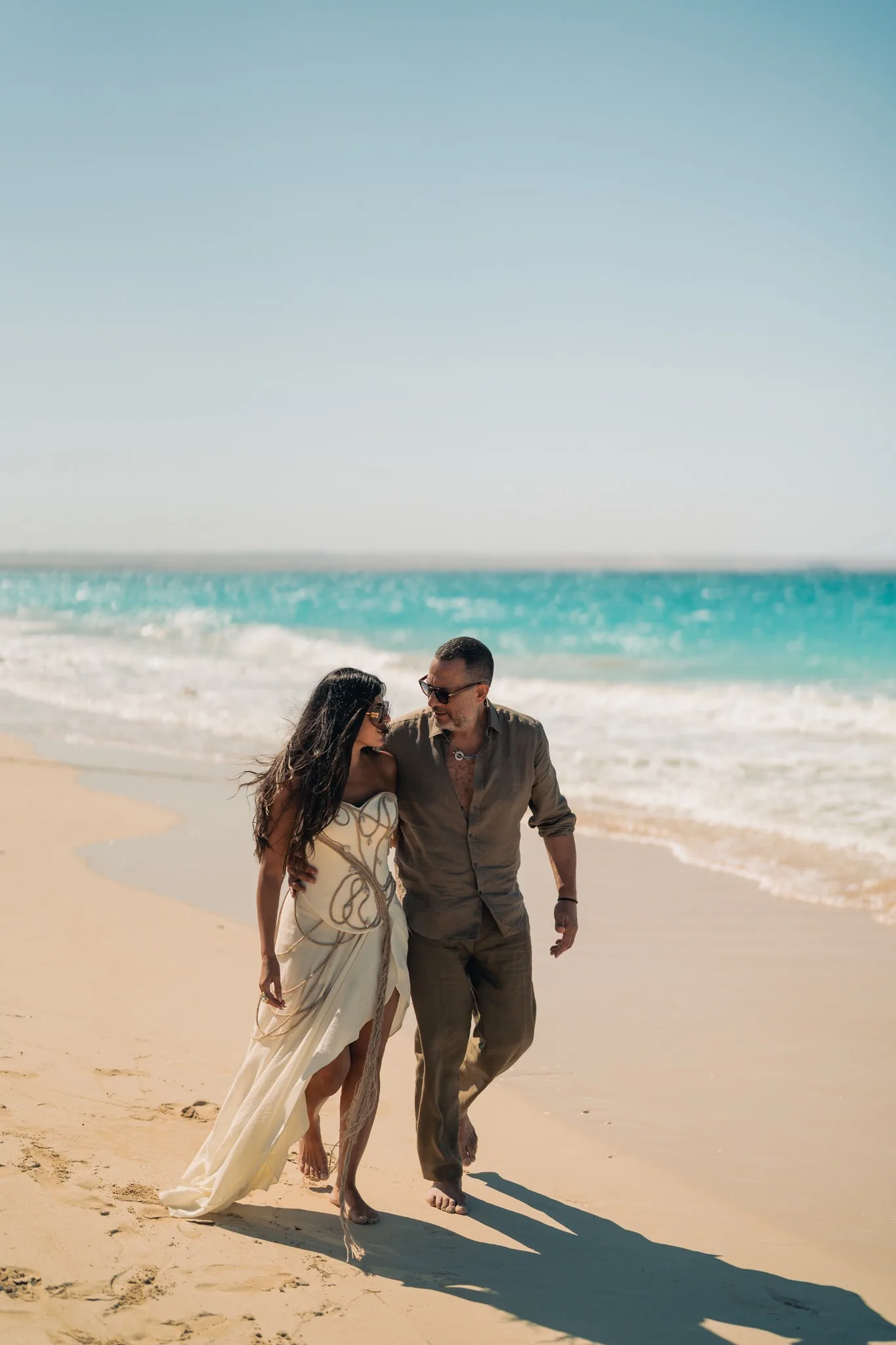 A couple walking along the shoreline at Route 5 Beach